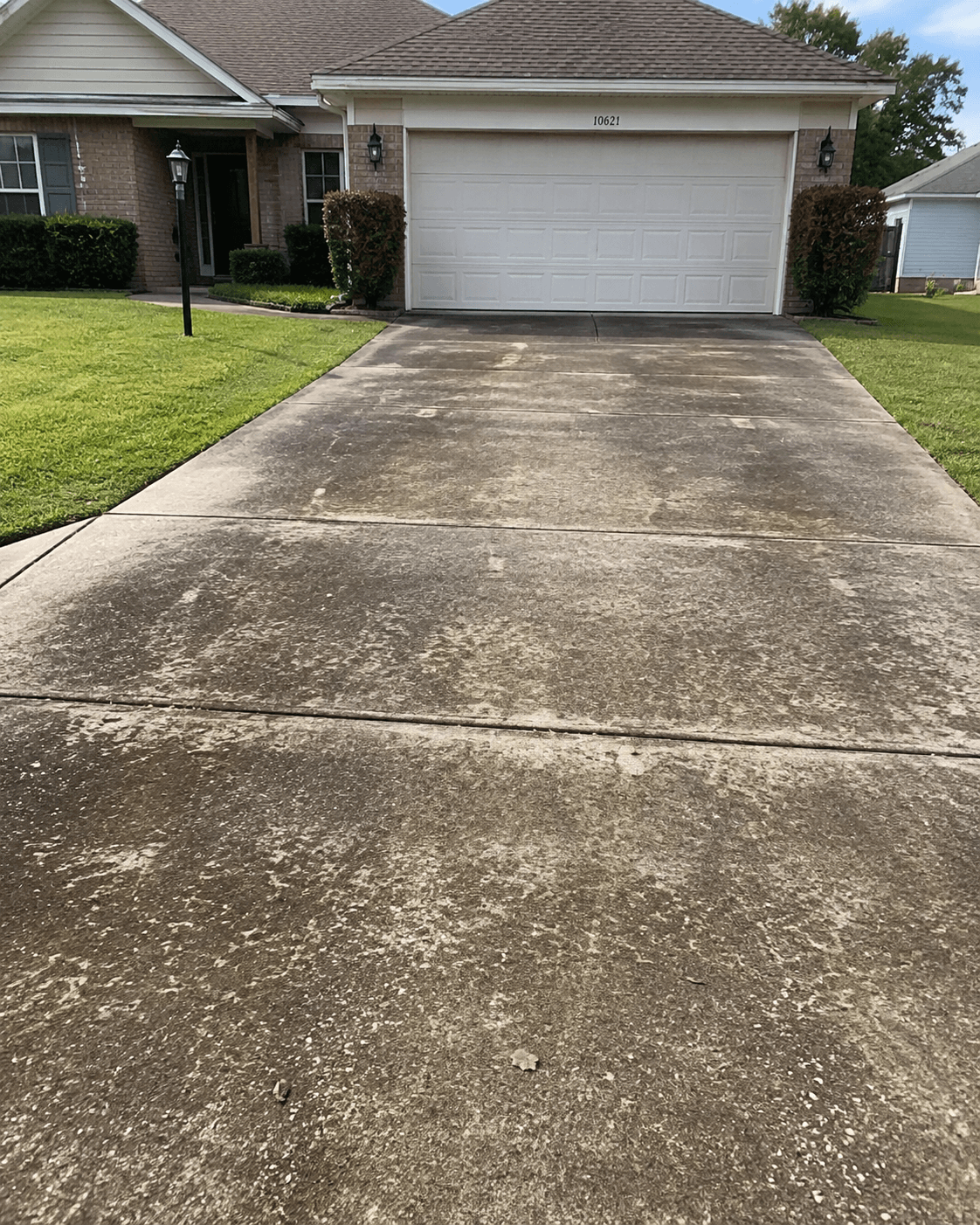 Dirty driveway before pressure washing